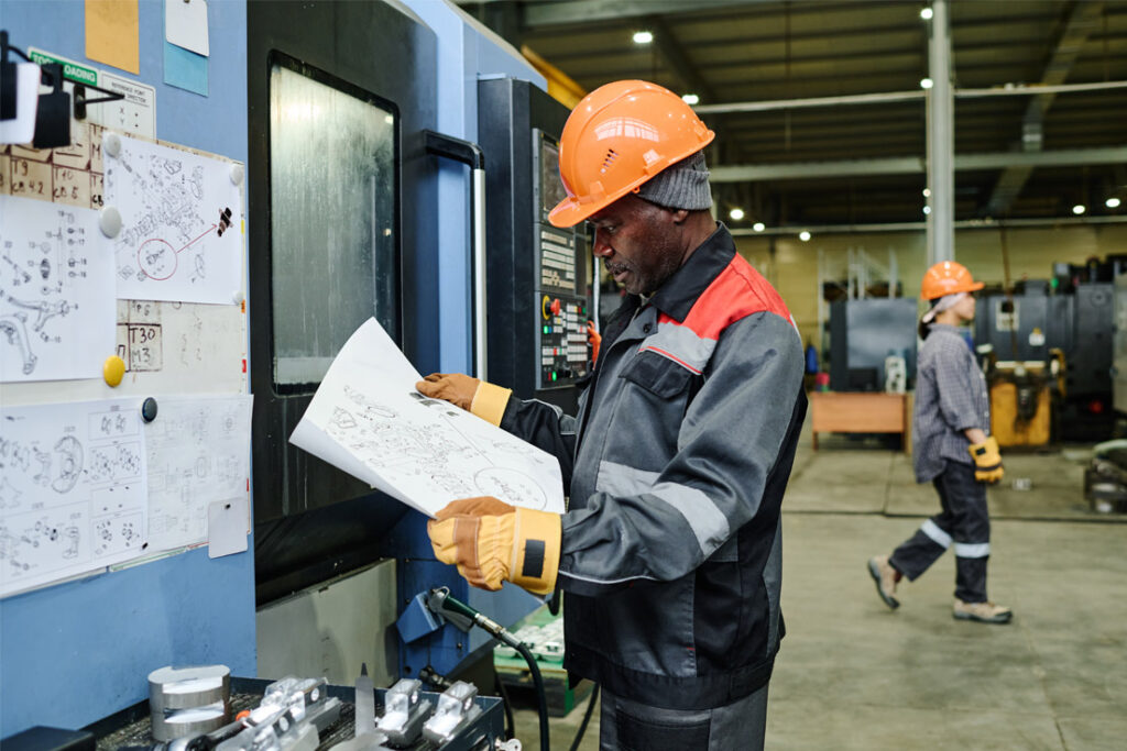 Product quality planning team reviewing manufacturing and process development procedures in an industrial environment
