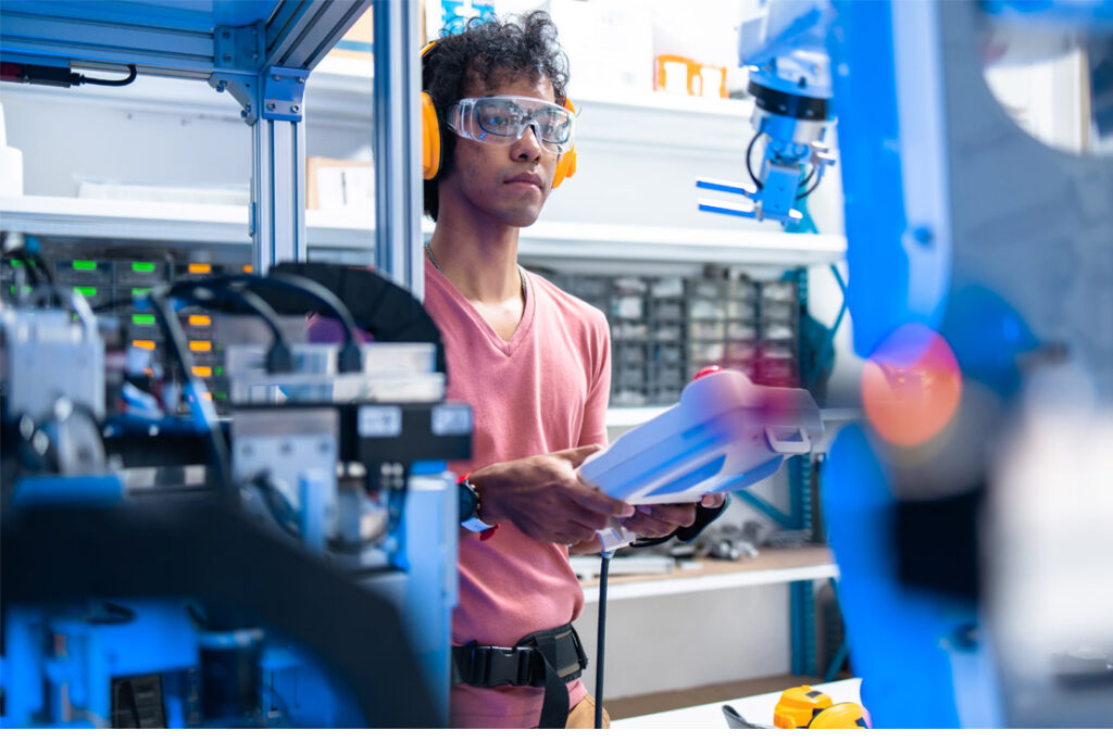 Engineering and quality professionals reviewing failure analysis and risk assessment procedures in a manufacturing environment