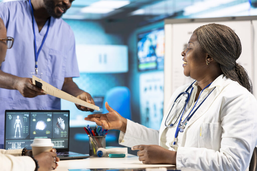 Lead auditor reviewing medical device quality management procedures in a regulated manufacturing facility
