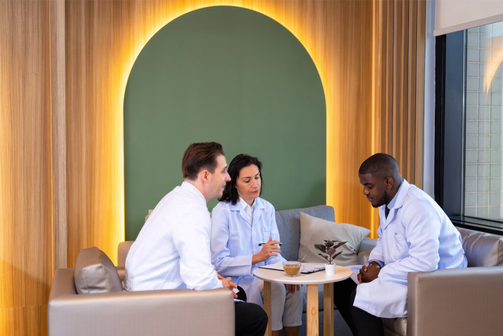 Medical device quality management team reviewing operational and compliance procedures in a regulated manufacturing environment