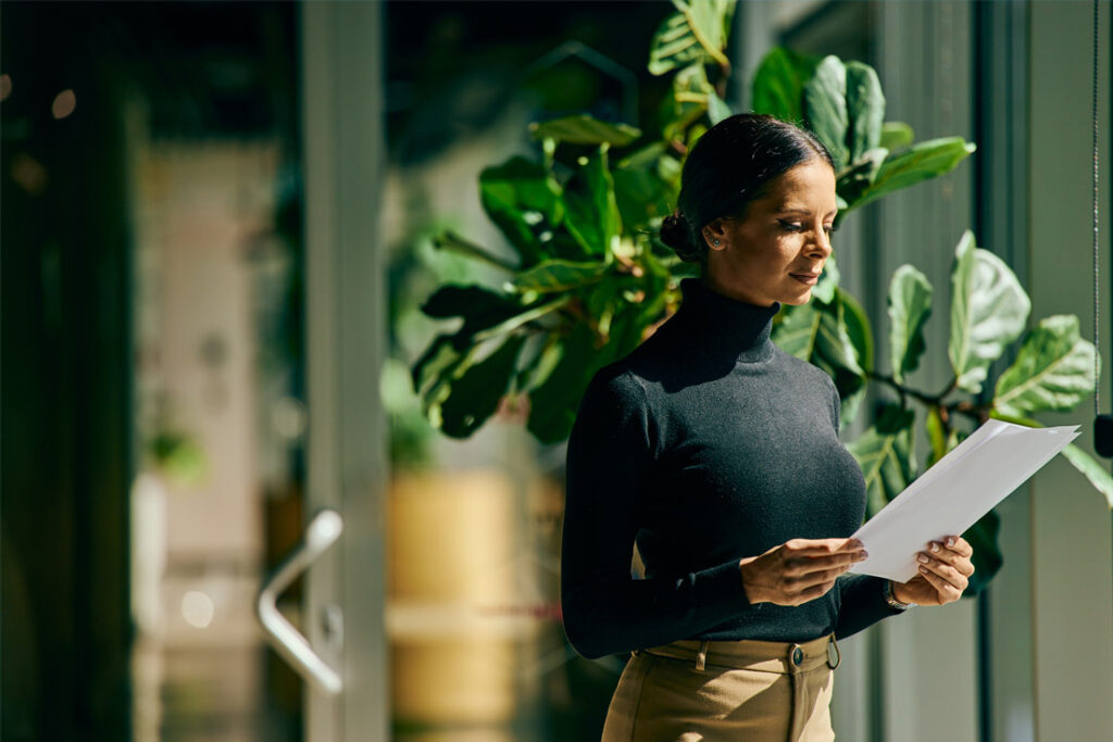 Internal safety auditor conducting a workplace compliance inspection at an industrial facility