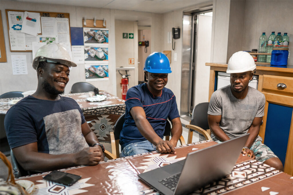 Quality management team reviewing operational procedures in a manufacturing environment