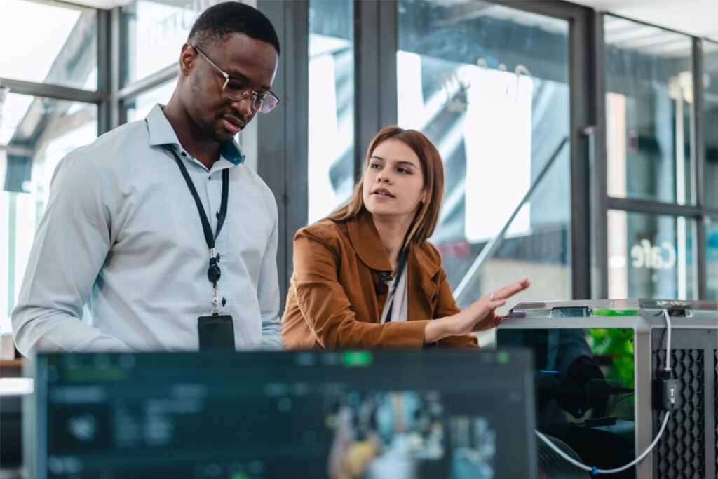 Information security auditor reviewing cybersecurity compliance procedures in a corporate environment